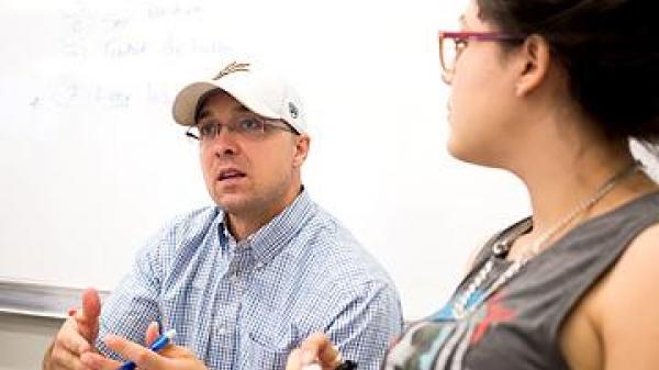 two students talking about collaboration